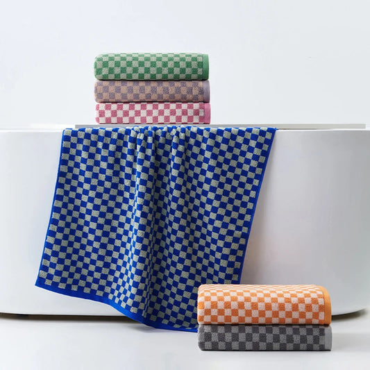 Soft and absorbent ultra-soft plaid cotton towel made from 100% combed cotton with jacquard weave, available in face towel and bath towel sizes